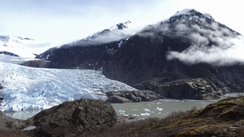 FILE - Chunks of ice float in Mendenhall Lake in front of the Mendenhall Glacier on April 29, 2023, in Juneau, Alaska. An Alaska man inadvertently filmed his own drowning on the glacial lake with a GoPro camera mounted on his helmet, but authorities who recovered the camera have not yet found his body, officials said Tuesday, July 18, 2023. (AP Photo/Becky Bohrer, File)