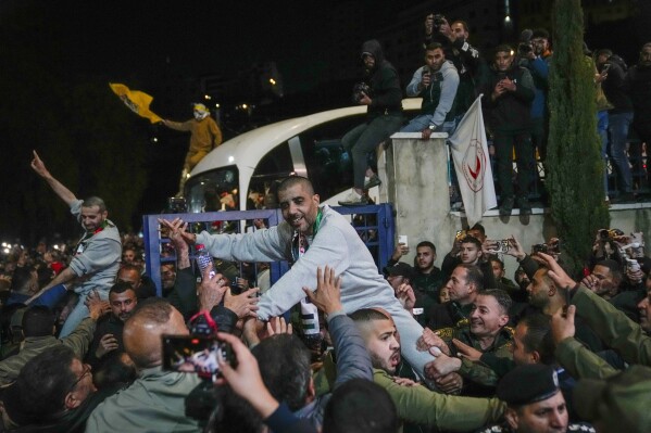 zaharia zubeidi , former leader of the al-aqsa martyrs brigade, an armed offshoot of the secular fatah party, center, is greeted upon his arrival after being released from an israeli prison in the west bank city of ramallah, thursday jan. 30, 2025.(ap photo/nasser nasser)