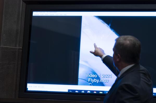 Deputy Director of Naval Intelligence Scott Bray points to a video display of a UAP during a hearing of the House Intelligence, Counterterrorism, Counterintelligence, and Counterproliferation Subcommittee hearing on 