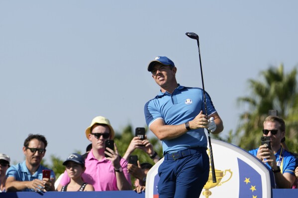Europe's Rory Mcilroy reacts to his tee shot on the 10th during a practice round ahead of the Ryder Cup at the Marco Simone Golf Club in Guidonia Montecelio, Italy, Wednesday, Sept. 27, 2023. The Ryder Cup starts Sept. 29, at the Marco Simone Golf Club. (AP Photo/Alessandra Tarantino)