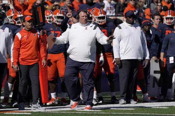 Illinois head coach Bret Bielema gestures on the sidelines during the first half of an NCAA college football game against Minnesota, Saturday, Oct. 15, 2022, in Champaign, Ill. (AP Photo/Charles Rex Arbogast)
