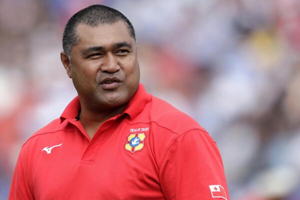 FILE - Tonga's rugby union coach Toutai Kefu watches his players warm up ahead of their Rugby World Cup Pool C game at Hanazono Rugby Stadium against Argentina in Osaka, Japan, Sept. 28, 2019. Tonga or Hong Kong will be Rugby World Cup-bound after a qualifying match on Queensland state's Sunshine Coast on Saturday, July 23, 2022. (AP Photo/Aaron Favila, FILE)