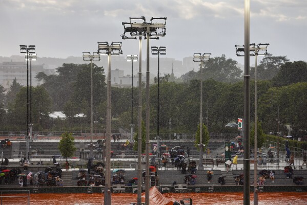 Rain interrupted matches of the French Open tennis tournament at the Roland Garros stadium in Paris, Friday, May 31, 2024. (AP Photo/Jean-Francois Badias)