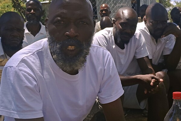 Ishmael Chokurongerwa, 56, a "self styled" prophet is seen at his shrine on a farm about 34 kilometers (21 miles) north of the capital, Harare, Wednesday, March, 13, 2024. Chokurongerwa led a sect with more than 100 members. Zimbabwean police on Wednesday said they arrested the man claiming to be a prophet of an apostolic sect at a shrine where believers stay in a compound and authorities found 16 unregistered graves, including those of infants, and more than 250 children used as cheap labor. (AP Photo)