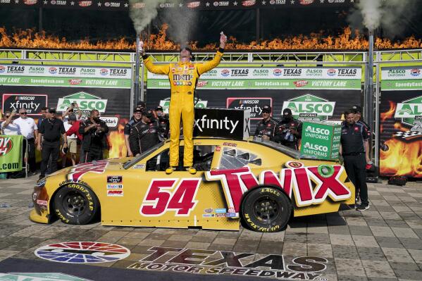 Kyle Busch celebrates in Victory Lane after winning a NASCAR Xfinity Series auto race at Texas Motor Speedway in Fort Worth, Texas, Saturday, June 12, 2021. (AP Photo/Tony Gutierrez)