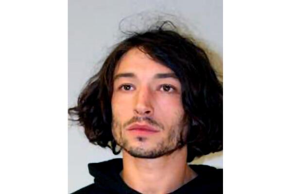 This undated photo provided by the Hawaii Police Department shows actor Ezra Miller. Miller known for playing the Flash in "Justice League" films was arrested on an assault charge. Police say Miller became irate after being asked to leave a Big Island home and threw a chair, hitting a woman in the head. It's Miller's second arrest on the Big Island in recent weeks. (Hawaii Police Department via AP)