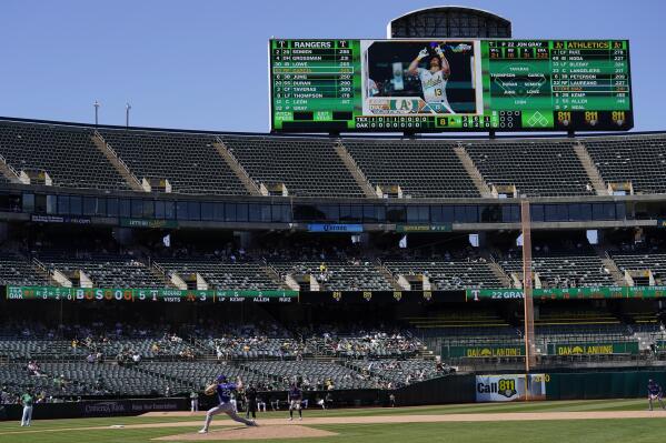 Texas Rangers pitcher Jon Gray (22) throws to an Oakland Athletics batter during the eighth inning of a baseball game in Oakland, Calif., Saturday, May 13, 2023. (AP Photo/Jeff Chiu)