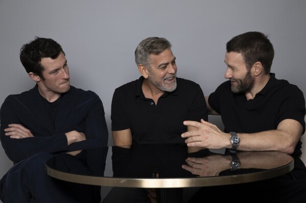 Callum Turner, from left, George Clooney and Joel Edgerton appear during a portrait session to promote the film "The Boys in the Boat," Saturday, Dec. 9, 2023, in Los Angeles. (Photo by Rebecca Cabage/Invision/AP)