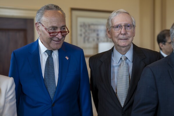 Senate Majority Leader Chuck Schumer, D-N.Y., left, and Senate Minority Leader Mitch McConnell, R-Ky., stand together during a meeting with visiting Italian Prime Minister Giorgia Meloni, at the Capitol in Washington, Thursday, July 27, 2023. Before adjourning for the August recess, the two leaders worked to authorize appropriations for fiscal year 2024 for military activities of the Department of Defense. (AP Photo/J. Scott Applewhite)