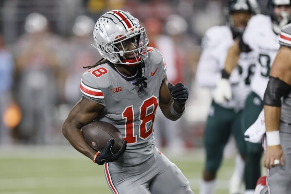 FILE - Ohio State receiver Marvin Harrison plays against Michigan State during an NCAA college football game Saturday, Nov. 11, 2023, in Columbus, Ohio. (AP Photo/Jay LaPrete, File)