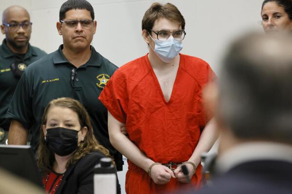 Marjory Stoneman Douglas High School shooter Nikolas Cruz is escorted into the courtroom for a hearing regarding possible jury misconduct during deliberations in the penalty phase of his trial, Friday, Oct. 14, 2022, at the Broward County Courthouse in Fort Lauderdale, Fla. (Amy Beth Bennett/South Florida Sun Sentinel via AP, Pool)