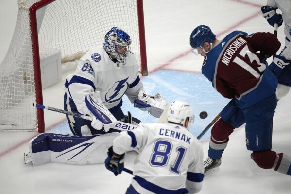 Colorado Avalanche right wing Valeri Nichushkin, right, shoots the puck past Tampa Bay Lightning goaltender Andrei Vasilevskiy, left, for a goal as defenseman Erik Cernak covers in the first period of an NHL hockey game Tuesday, Feb. 14, 2023, in Denver. (AP Photo/David Zalubowski)
