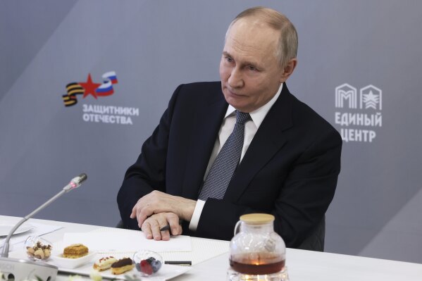 Russian President Vladimir Putin attends a meeting of The Defenders of the Fatherland Foundation in Moscow, Russia, Thursday, March 6, 2025. (Mikhail Metzel, Sputnik, Kremlin Pool Photo via AP)