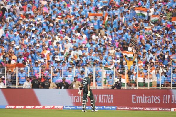 Pakistan's captain Babar Azam leaves the ground after losing his wicket during the ICC Men's Cricket World Cup match between India and Pakistan in Ahmedabad, India, Saturday, Oct. 14, 2023. (AP Photo/Aijaz Rahi)