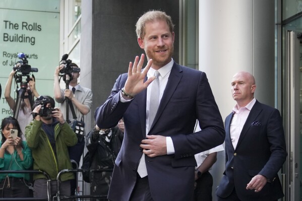 FILE - Prince Harry leaves the High Court after giving evidence in London, Wednesday, June 7, 2023. Prince Harry is seeking 320,000 pounds ($406,000) in his phone hacking lawsuit against Mirror Group Newspapers. The Duke of Sussex's lawyer submitted the claim in a court document Friday, June 30, 2023, at the conclusion of the trial that began in early May. (AP Photo/Kin Cheung, File)