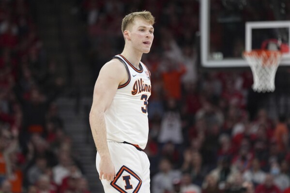 Illinois forward Marcus Domask reacts after making a 3-point shot during the second half of an NCAA college basketball game against Wisconsin in the championship of the Big Ten Conference tournament, Sunday, March 17, 2024, in Minneapolis. (AP Photo/Abbie Parr)