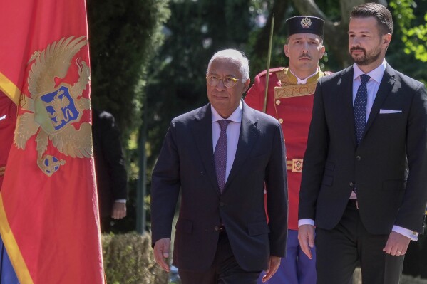 European Council President Antonio Costa, left, reviews the honour guard with Montenegro's President Jakov Milatovic during a welcome ceremony in Montenegro's capital Podgorica, Wednesday, May 14, 2025. (AP Photo/Risto Bozovic)