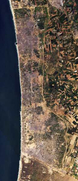 This satellite photo from Planet Labs PBC shows the Gaza Strip on Tuesday, Jan 30, 2024. Satellite photos show new demolition along a 1-kilometer-deep path on the Gaza Strip's border with Israel, according an analysis by The Associated Press and expert reports. The destruction comes as Israel has said it wants to establish a buffer zone there, further tearing away at land the Palestinians want for a state over international objections. (Planet Labs PBC via AP)
