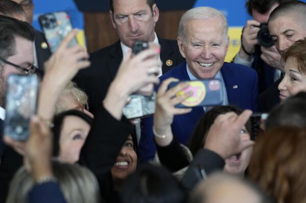 FILE - President Joe Biden greets people after speaking about health care and prescription drug costs at the University of Nevada, Las Vegas, Wednesday, March 15, 2023, in Las Vegas. (AP Photo/John Locher, File)