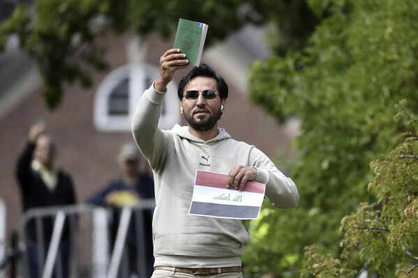 FILE - Protestor Salwan Momika outside the Iraqi embassy in Stockholm, Thursday, July 20, 2023. Sweden has reportedly withdrawn the residence permit of an Iraqi man who staged a series of public desecrations of the Quran this year but has stayed his deportation, saying his life would be in danger if he were returned to Iraq. Sweden’s Migration Agency made the decision this week after determining that Salwan Momika had provided false information in his application for asylum, it was reported Thursday, Oct. 26. (Oscar Olsson/TT via AP, file)