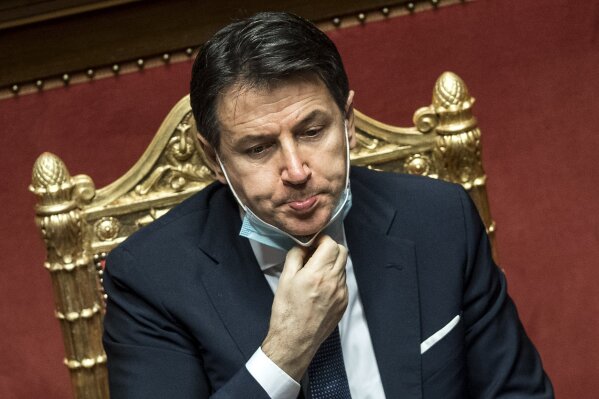 Italian Prime Minister Giuseppe Conte speaks during his final address at the Senate prior to a confidence vote, in Rome, Tuesday, Jan. 19, 2021. Italian Premier Giuseppe Conte fights for his political life with an address aimed at shoring up support for his government, which has come under fire from former Premier Matteo Renzi's tiny but key Italia Viva (Italy Alive) party over plans to relaunch the pandemic-ravaged economy. (Roberto Monaldo/ Lapresse via AP)