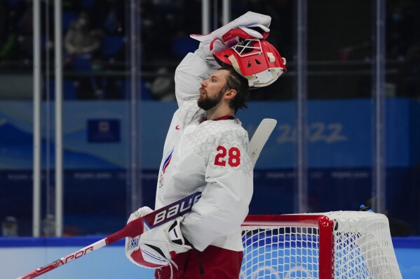 FILE - Russian Olympic Committee goalkeeper Ivan Fedotov (28) reacts after a goal by Finland's Hannes Bjorninen during the men's gold medal hockey game at the 2022 Winter Olympics, Sunday, Feb. 20, 2022, in Beijing. The International Ice Hockey Federation has ruled in favor of the Philadelphia Flyers by agreeing that Russian goaltender Ivan Fedotov had a valid NHL contract for the upcoming season. The decision rendered Monday, Aug. 14, 2023, paves the way for Fedotov to play in North America, like he planned to do a year ago before being conscripted into the Russian military. (AP Photo/Petr David Josek, File)