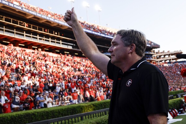 Georgia head coach Kirby Smart thanks the fans after defeating Auburn during the second half of an NCAA football game, Saturday, Sept. 30, 2023, in Auburn, Ala. (AP Photo/ Butch Dill )