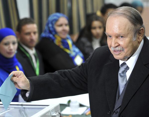 FILE -In this Thursday, Nov. 29, 2012, file photo, Algerian President Abdelaziz Bouteflika casts his ballot for local elections in Algiers. Former Algerian President Bouteflika, who fought for independence from France in the 1950s and 1960s and was ousted amid pro-democracy protests in 2019 after 20 years in power, has died at age 84, state television announced Friday, Sept. 17, 2021. (AP Photo/Anis Belghoul, File)
