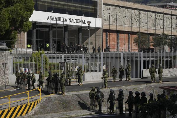 Security forces guard the National Assembly in Quito, Ecuador, Wednesday, May 17, 2023. Ecuadorian President Guillermo Lasso on Wednesday put an end to impeachment proceedings against him by dissolving the opposition-led National Assembly, which had accused him of embezzlement. (AP Photo/Dolores Ochoa)