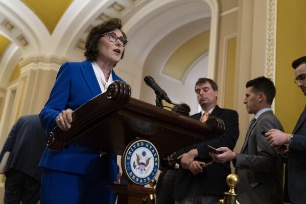 FILE - Sen. Jacky Rosen, D-Nev., speaks to media after a Senate Democratic policy luncheon, Oct. 17, 2023, on Capitol Hill in Washington. A federal grand jury has indicted a Las Vegas man arrested last month on suspicion of making antisemitic threats against Rosen and her family, along with the family of another U.S. senator, according to court records. (APPhoto/Stephanie Scarbrough, File)