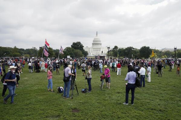 People attend a rally near the U.S. Capitol in Washington, Saturday, Sept. 18, 2021. The rally was planned by allies of former President Donald Trump and aimed at supporting the so-called "political prisoners" of the Jan. 6 insurrection at the U.S. Capitol. (AP Photo/Jose Luis Magana)