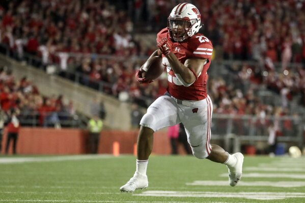 FILE - In this Saturday, Oct. 6, 2018, file photo, Wisconsin's Jonathan Taylor runs for a touchdown during the second half of an NCAA college football game against Nebraska in Madison, Wis. Taylor was selected a preseason All-American by AP poll voters after running for more than 2,00 yards last season. (AP Photo/Morry Gash, File)