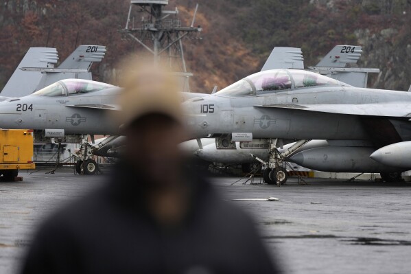 U.S. F-18 Super Hornet fighter jets are seen on the flight deck of the Nimitz-class nuclear-powered aircraft carrier USS Carl Vinson at a port in Busan, South Korea, Monday, March 3, 2025. (AP Photo/Lee Jin-man, Pool)