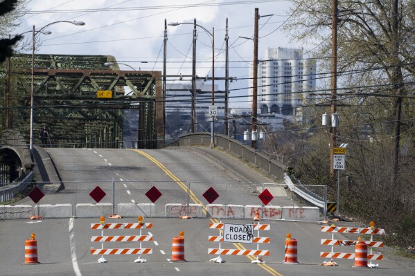 The Fishing Wars Memorial Bridge, which has been closed indefinitely since October 2023 after the Federal Highway Administration raised safety concerns, is shown Tuesday, March 26, 2024, in Tacoma, Wash. Nearby business owners say they have noticed a decrease in customers as traffic has slowed on their street due to the closure. (AP Photo/Lindsey Wasson)