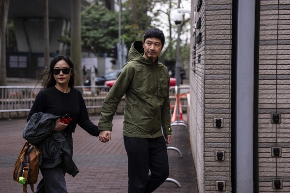 Actor Gregory Wong, one of the six defendants who pleaded not guilty to riot in a trial involving protesters who stormed the Legislative Council during the pro-democracy protests in 2019, arrives at the court before verdict in Hong Kong, Thursday, Feb. 1, 2024. A Hong Kong court on Thursday convicted four people for rioting over the storming of the city's legislative council building at the height of the anti-government protests more than four years ago. (AP Photo/Louise Delmotte)