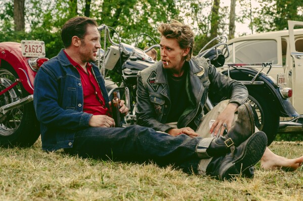 This image released by Focus Features shows Tom Hardy, left, and Austin Butler in a scene from "The Bikeriders." (Focus Features via AP)