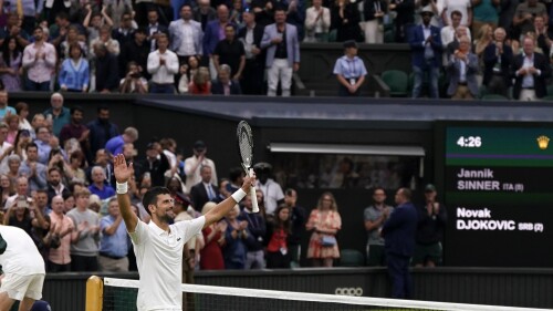 Serbia's Novak Djokovic celebrates winning against Italy's Jannik Sinner in their men's singles semifinal match on day twelve of the Wimbledon tennis championships in London, Friday, July 14, 2023. (AP Photo/Alberto Pezzali)