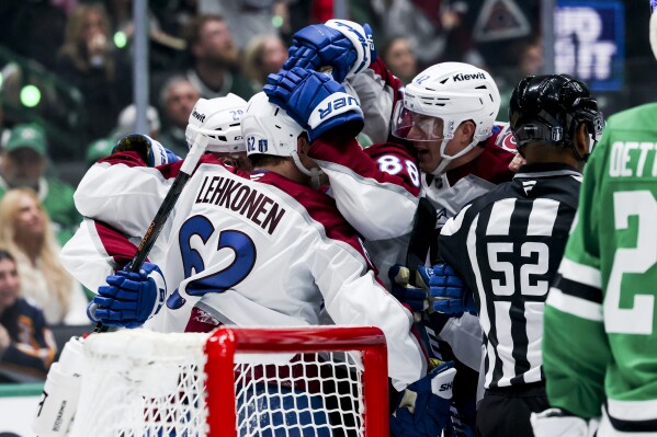 Colorado Avalanche left wing Artturi Lehkonen (62) celebrates with teammates after scoring against the Dallas Stars in the second period during a first-round NHL hockey playoff game in Dallas, Saturday, April 19, 2025. (AP Photo/Gareth Patterson)