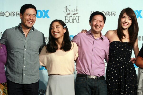 FILE - In this Aug. 5, 2016 file photo, Randall Park, from left, Constance Wu, Ken Jeong and Ann Hsu pose for photographers during a media event announcing their comedy series "Fresh off the Boat" in Taipei, Taiwan. ABC’s “Fresh Off the Boat” is coming to an end after six seasons. The network said Friday, Nov. 8, 2019,  the comedy about an Asian American family in the 1990s will wrap with an hour-long finale.  The last episode will air Feb. 21. (AP Photo/Chiang Ying-ying, File