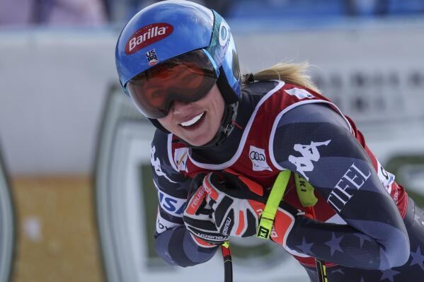United States' Mikaela Shiffrin smiles as she gets to the finish area after completing an alpine ski, women's World Cup downhill race, in Cortina d'Ampezzo, Italy, Friday, Jan. 20, 2023. (AP Photo/Alessandro Trovati)