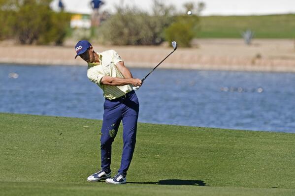 Billy Horschel hits across water on the 15th hole during the second round of the Phoenix Open golf tournament Friday Feb. 10, 2023, in Scottsdale, Ariz. (AP Photo/Darryl Webb)