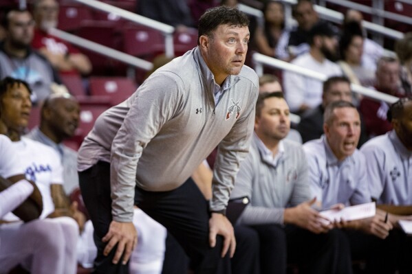 FILE - New Mexico State coach Greg Heiar watches players during a game Nov. 2, 2022, in Las Cruces, N.M. Heiar has been hired as the head coach at Mineral Area College, a junior college in central Missouri. Heiar was dismissed from New Mexico State in February in the wake of hazing allegations within the team that shut down the program for the season. (Meg Potter/The Las Cruces Sun News via AP, File)