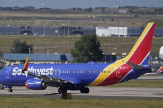 FILE - A Southwest Airlines jetliner waits on a runway for departure from Denver International Airport Friday, Sept. 1, 2023, in Denver. Activist shareholder Elliott Investment Management has taken a $1.9 billion stake in Southwest Airlines. The investment firm said Monday, June 10, 2024, that Southwest failed to keep up with other airlines and suffers from outdated technology and operations. (ĢӰԺ Photo/David Zalubowski, File)