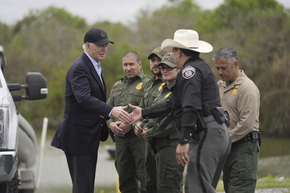 FILE - President Joe Biden talks with the U.S. Border Patrol and local officials, as he looks over the southern border, Feb. 29, 2024, in Brownsville, Texas, along the Rio Grande. (Ǻ Photo/Evan Vucci, File)