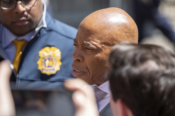 New York City Mayor Eric Adams visits the courthouse where jury selection is underway in the Donald Trump hush money trial in New York on Tuesday, April 16, 2024. (AP Photo/Ted Shaffrey)