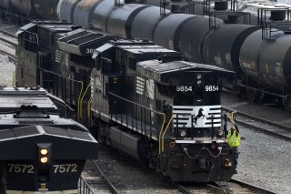 FILE - Norfolk Southern locomotives are moved through the Conway Terminal in Conway, Pa., June 17, 2023. Norfolk Southern wants its shareholders to back its current management team and strategy and reject a bid from a group of investors to take over the railroad. Norfolk Southern urged shareholders Monday, Feb. 26, 2024 to reject Ancora Holdings eight board nominees when it filed its proxy statement. (AP Photo/Gene J. Puskar, file)