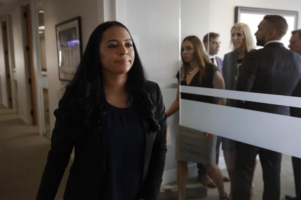FILE - Former Olympic gymnast Tasha Schwikert leaves a conference room after speaking to reporters Monday, Oct. 29, 2018, in Los Angeles. Schwikert, a member of the 2000 Olympic team and one of hundreds of athletes sexually abused by former USA Gymnastics team doctor Larry Nassar, has been appointed to USA Gymnastics board of directors, a position created as part of the settlement between the organization and survivors of Nassar's abuse. (AP Photo/Jae C. Hong, File)