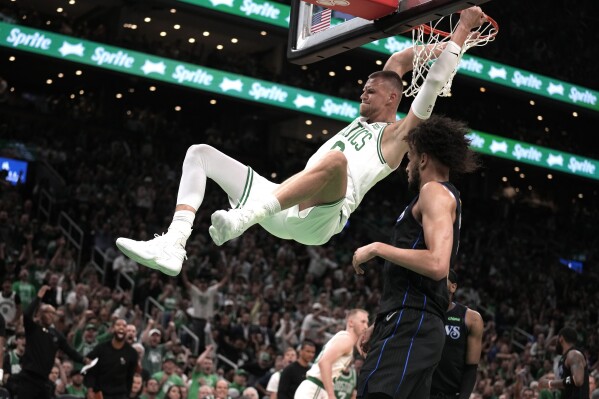 Celtics rout Mavericks 107-89 in Game 1 of NBA Finals behind Brown,  returning Porzingis | AP News