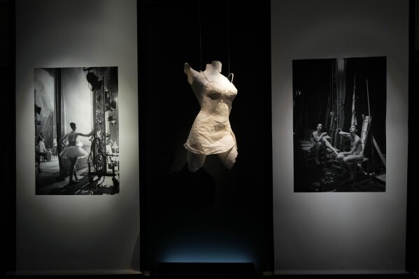 Pictures are displayed during the unveiling at La Scala Opera House of the photo exhibition 'Lo sguardo nascosto' ( The hidden gaze) by photographer Gerard Uferas, in Milan, Italy, Tuesday, Feb. 11, 2025. (AP Photo/Luca Bruno)