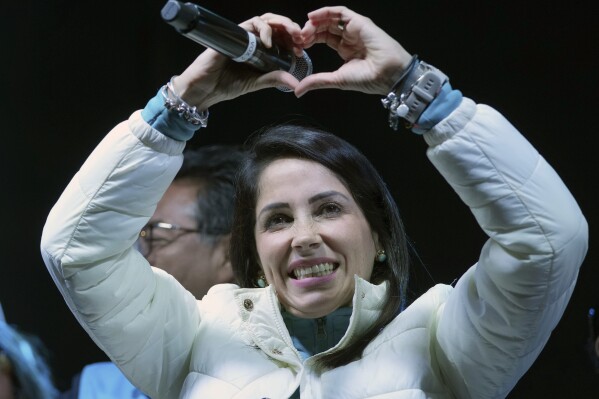 Presidential candidate Luisa González, of the Citizen's Revolution Political Movement, celebrates after early results show her ahead in a snap election, in Quito, Ecuador, Sunday, Aug. 20, 2023. The election was called after President Guillermo Lasso dissolved the National Assembly by decree in May to avoid being impeached. (AP Photo/Dolores Ochoa)